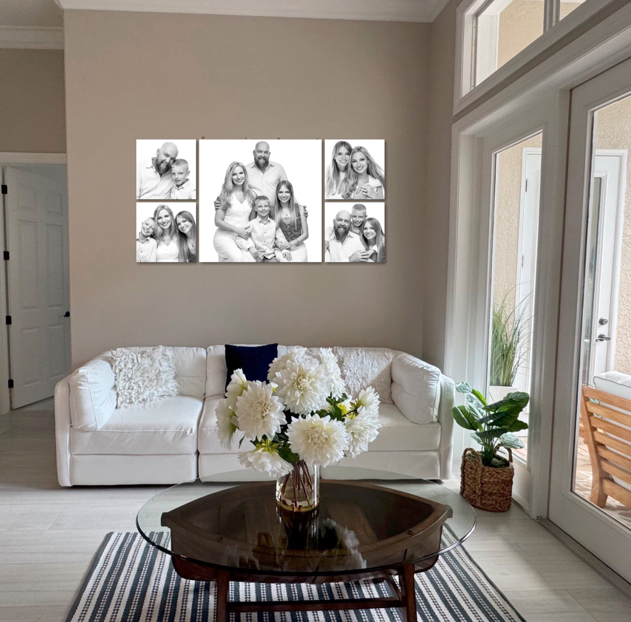 Black and white family portrait wall collection displayed in home living room
