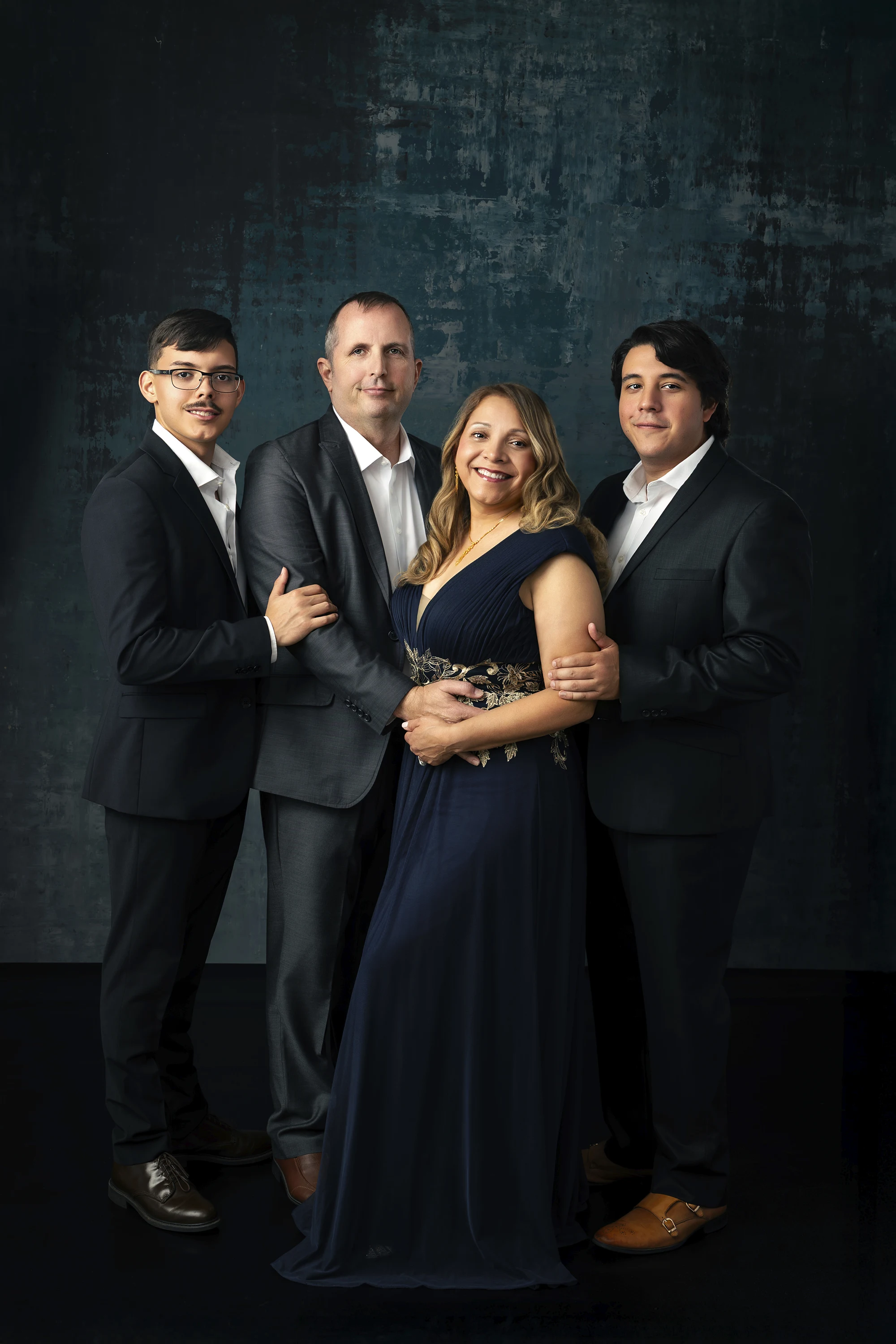 Deep jewel tones family portrait styling — navy and burgundy elegant family photography